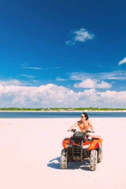 istock Young man driving off road ATV 979575564