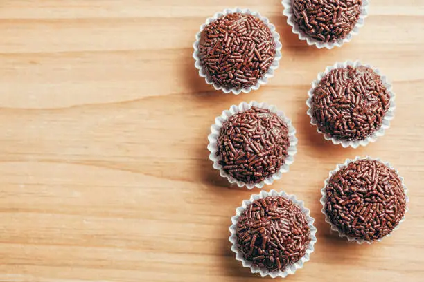 Brigadeiro is a typical homemade chocolate truffle from Brazil. Cocoa, condensed milk and sprinkles of chocolate. Common in children birthday party.