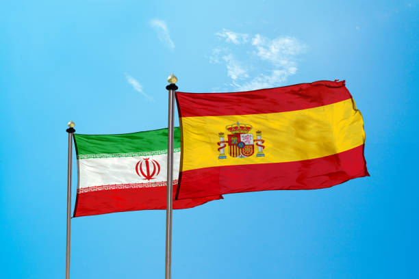 istock Iran vs Spain - Flag on the mast 979578740