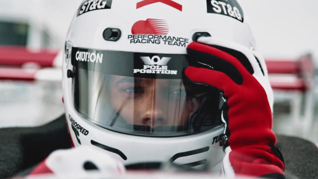 Racedriver closes his visor