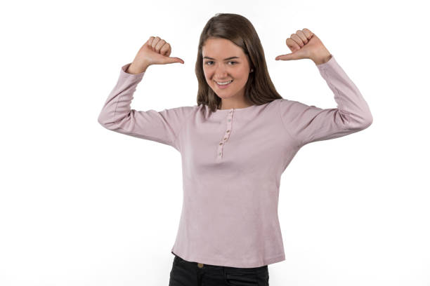 istock Young woman pointing to herself with both arms 979579628