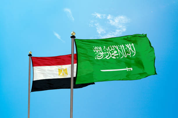 istock Egypt vs Saudi Arabia Flag on the mast 979579656