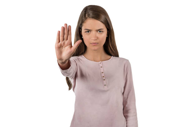 istock Young woman making stop sign with her hand 979579962