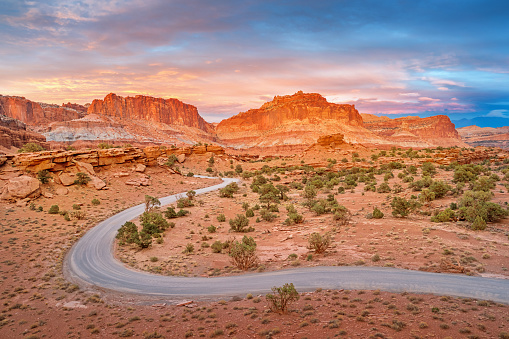 Stock photograph of a winding dirt road in Capitol Reef National Park Utah USA during sunset