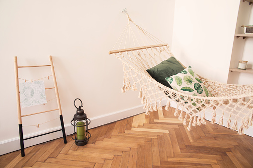 Modern and stylish bedroom with natural string hammock