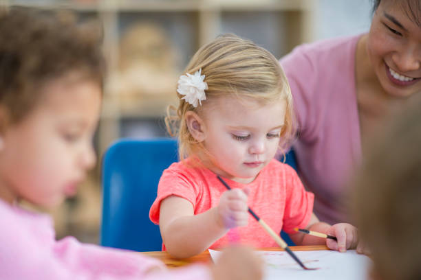 istock Preschool kid painting 979588238