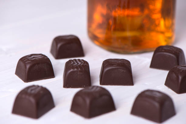 Chocolate And Whiskey On Wooden Background