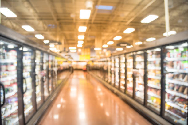 istock Abstract blurred fridge shelves different brands, flavors ice cream 979591260