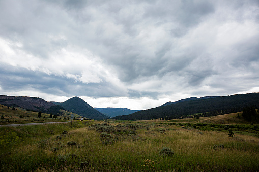 A gray sky sitting over the valleys in Big Sky, Montana