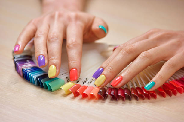 istock Summer colorful manicure on female hands. 979619794