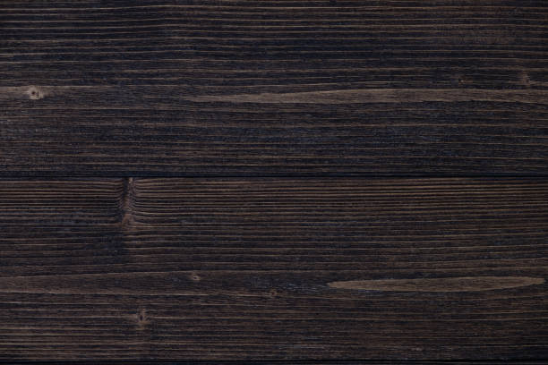 istock Dark brown wood texture with natural striped pattern background 979620252