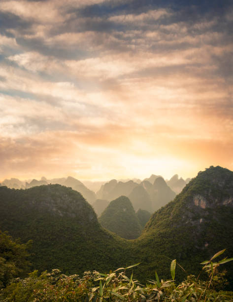 Sunset Over A Karst Landscape On Cat Ba Island In Vietnam Sunset Over A Karst Landscape On Cat Ba Island In Vietnam haiphong province photos stock pictures, royalty-free photos & images