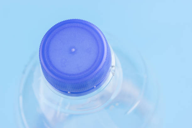 Plastic bottles of water close-up on blue background