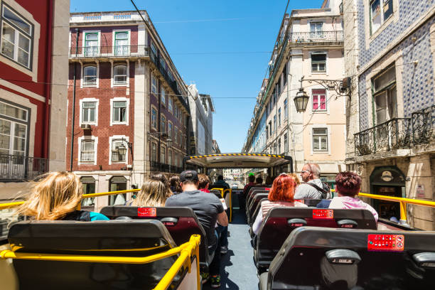 Carris bus 781 in Lisbon approaching the stop with information panel on waiting times.