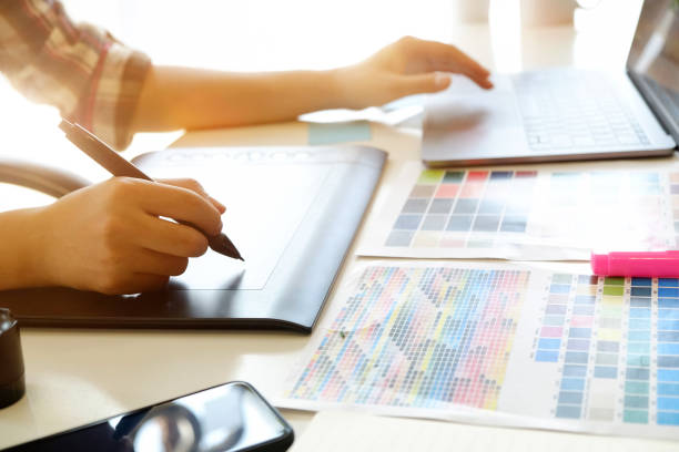 istock Artist or graphic designer working on digital tablet in studio office. 979631616