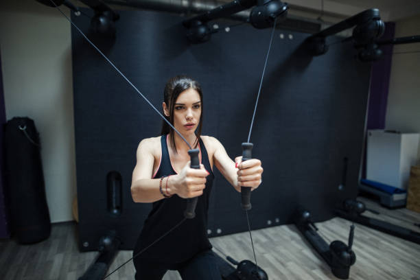 istock Woman workout on kinesis machine 979635042