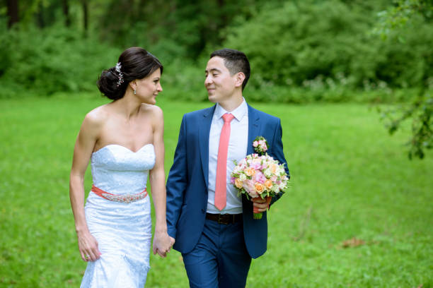 istock Wedding couple on the nature is walking 979654514