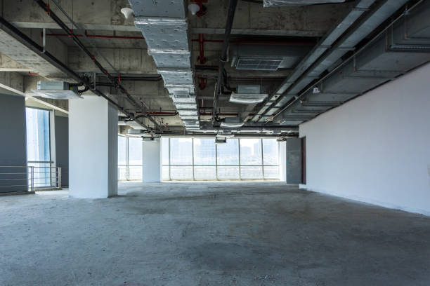 istock Unfinished interior of business center under construction in grey colours 979658002