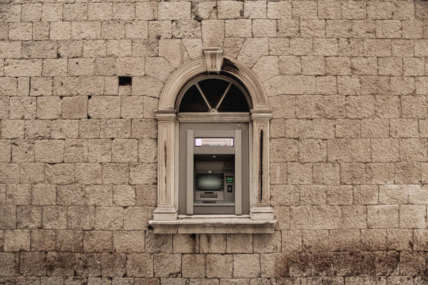Atm on stone wall. Trogir, Croatia.
