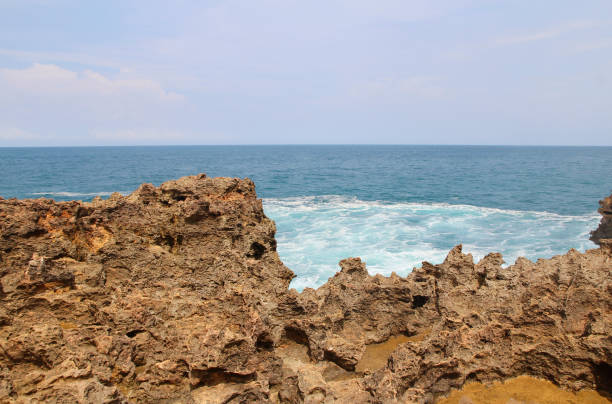 istock Natural rock formation with the wave at Timang Beach 979670792