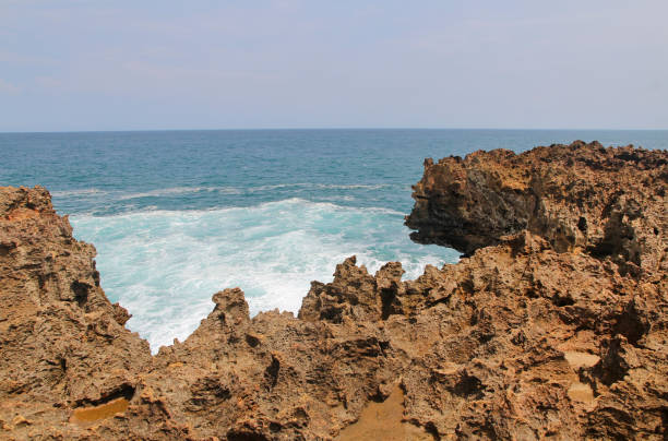 istock Natural rock formation with the wave at Timang Beach 979670974