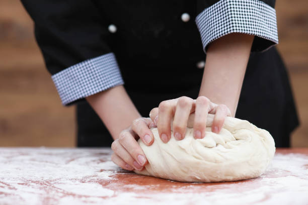 istock the cook makes flour for baking on the table 979675564