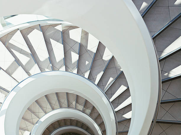 directly above modern, spiral staircase - architectuur stockfoto's en -beelden
