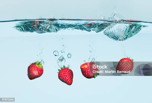 Strawberries Splashing In Water Stock Photo - Download Image Now - Water, Strawberry, Fruit