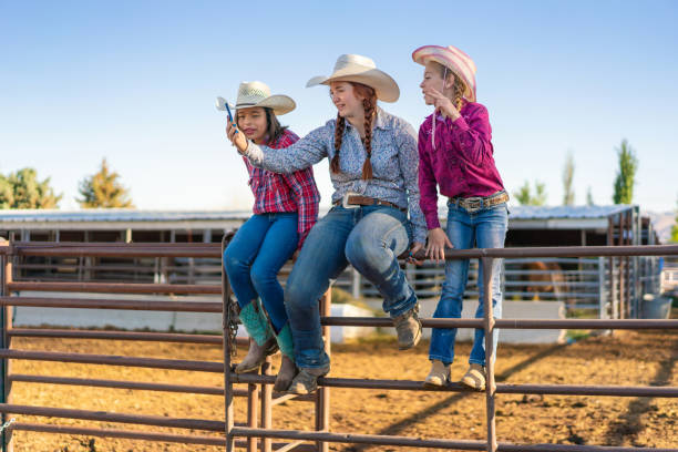 istock Cowgirls taking a selfie at ranch 979744064