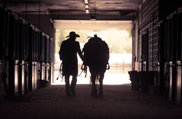 istock Cowboy at a horse stable 979747162