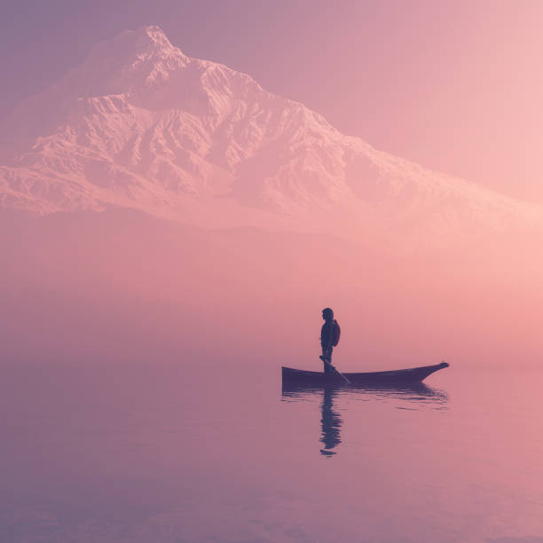 Man sitting on a boat on the mountain lake
