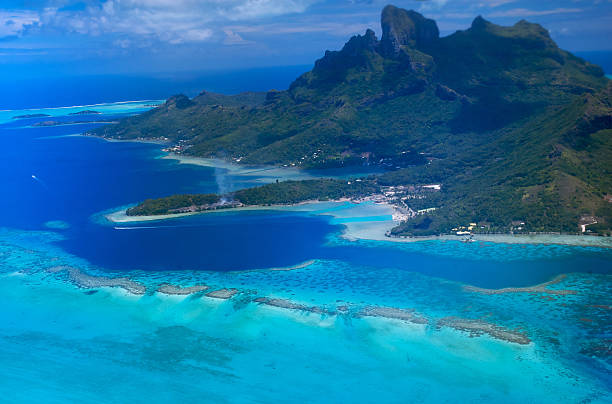 Aerial view of Polynesia islands and pristine blue ocean stock photo