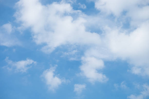 istock White Clouds on the bright sunny blue sky. Nature background. 979757550