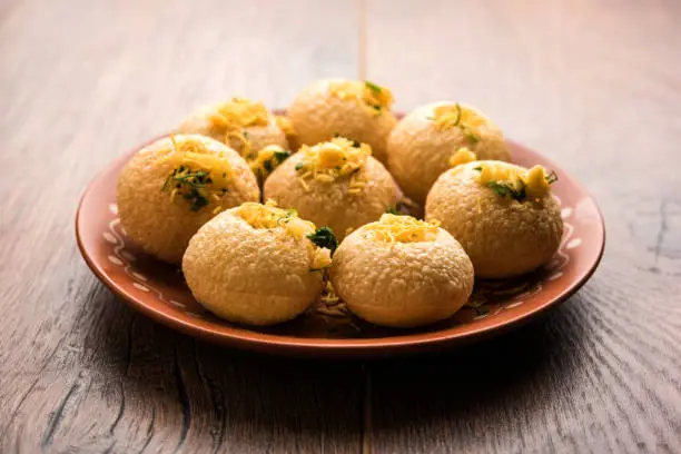 Pani Puri OR Golgappa is a popular Indian Chat menu, selective focus