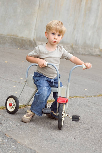 istock yong biker - little boy tricycle 97979761