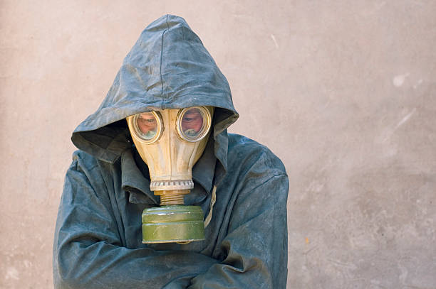 istock man in gas mask and groundsheet 97980046