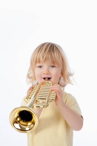 istock boy with toy trumpet 97980679