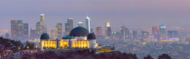 Griffith 0bservatory Park with Los Angeles skyline at Twilight Panorama Tourists enjoying evening downtown view of Los Angeles griffith park observatory stock pictures, royalty-free photos & images