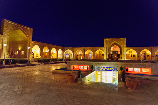 Isfahan, Iran - March 20, 2018: Courtyard of Shah Abbasi or Madar Shah Caravanserai at night