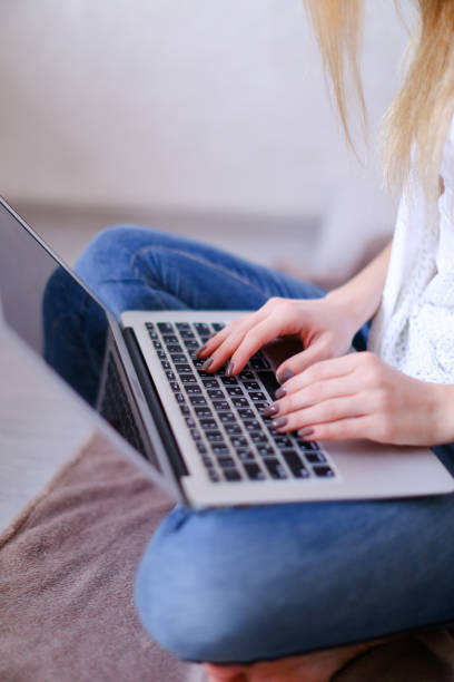 istock Closeup woman hands typing on laptop keyboard 979874350