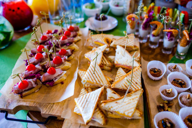 istock Buffet table of reception with burgers, cold snacks, meat and salads 979877954