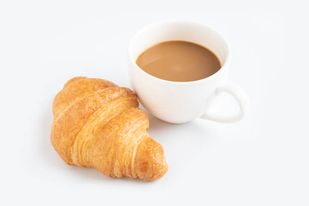 istock Coffee and croissant on white background 979878216