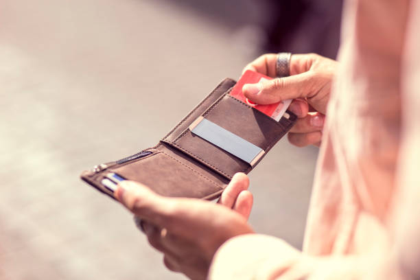 istock Close Up holding Leather Brown Wallet 979879182