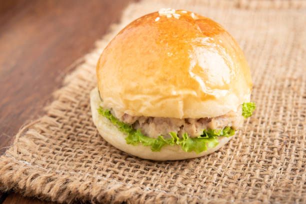 istock tuna burger on wood background. 979885788