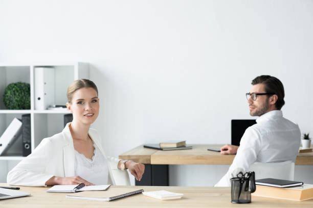 istock young business colleagues sitting at workplace in office 979891112