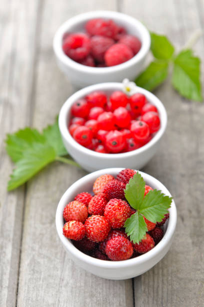 istock red berries in a little bowls on table 979899878