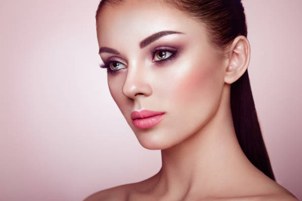 istock Beautiful woman face with perfect makeup 979907382