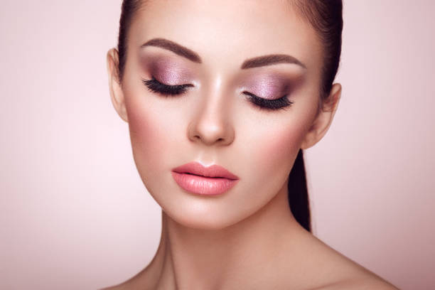 istock Beautiful woman face with perfect makeup 979909846