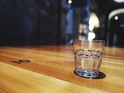 Empty glass on a wooden table