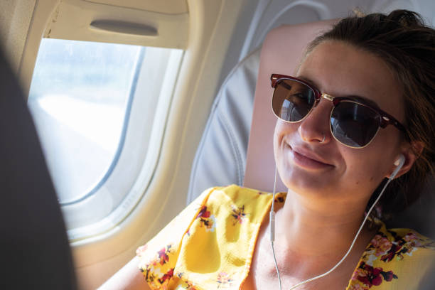 istock Young Woman Enjoying Flying with Airplane 979916314